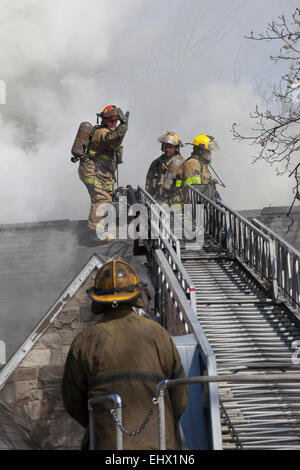 Detroit, Michigan - Firefighters battle a fire which destroyed a vacant home in Detroit's Morningside neighborhood. Stock Photo