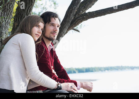 Lake tree young couple portrait relaxing Stock Photo