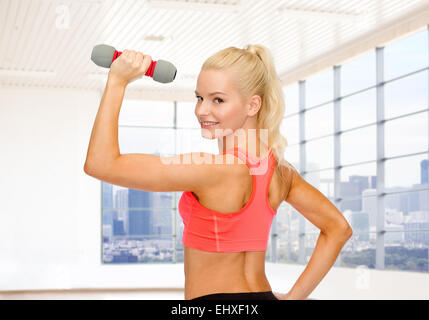 close up of sporty woman flexing her bicep Stock Photo