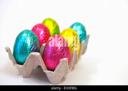 Festivals, Religious, Easter, Multi coloured chocolate eggs in carton. Stock Photo