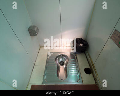 Squat toilet made of metal Stock Photo