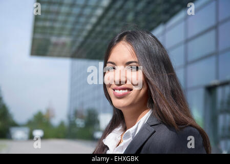 Young happy dark haired businesswoman portrait Stock Photo