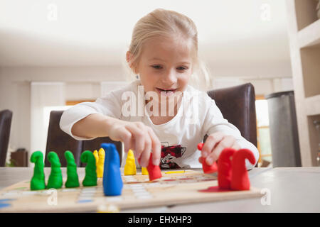 Girl playing board game, Bavaria, Germany Stock Photo