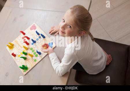 Girl playing board game, Bavaria, Germany Stock Photo