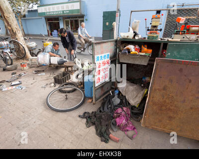 Mobile scooter and motorcycle repair shop on the streets of Shanghai, China Stock Photo