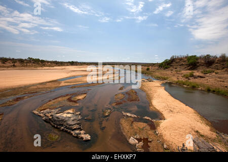 River Flowing Through Kruger National Park At Sunset With A Herd Of 