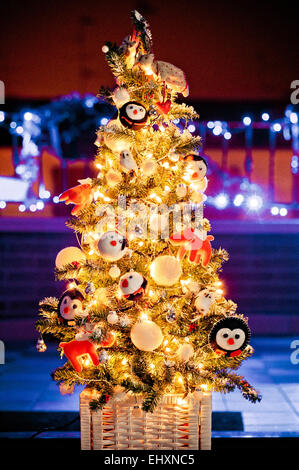 decorated Christmas tree with de-focused lights background Stock Photo