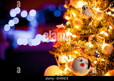 decorated Christmas tree with de-focused lights background Stock Photo