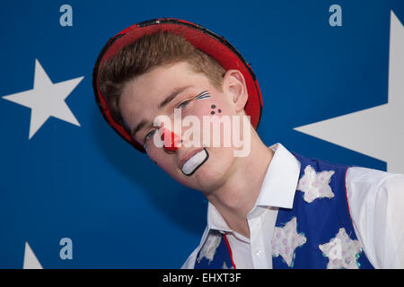 Southport, Merseyside, UK 18th March, 2015. 'Dexter the Clown' aka Deklan Ellis from Liverpool prepares for his opening performance.  The all-human circus spectacular, owned by Show Directors John Courtney and Stephen Courtney trading as Circus Vegas/American Circus has arrived in SOUTHPORT, the travelling show produced by the famous Uncle Sam's Great American Circus, tours for ten months a year.  It is an Irish organisation, but its star-spangled selection of American Kenworth and Peterbilt decorated trucks look the part when they roll into town, Stock Photo