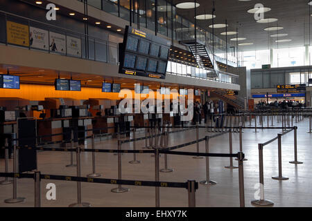 Copenhagen, Denmark. 18th March, 2014. The check-in area for Ryanair’s first flight out of Copenhagen Airport. The passengers were met by demonstrators outside Terminal 2 not only from the flight crew unions, but from many supporting trade unions. Ryanair has refused to enter into a Danish collective agreement for crews attached to a new Copenhagen base.  The flight was delayed more than 3 hours in Copenhagen before returning to Dublin due to delayed handling and refuelling. The next meeting in the Danish Labour Court is  26th March. Credit:  Niels Quist/Alamy Live News Stock Photo