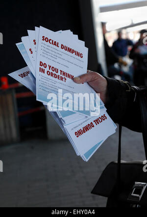 Copenhagen, Denmark. 18th March, 2014. The passengers for Ryanair’s first flight out of Copenhagen Airport were met by demonstrators outside Terminal 2 not only from the flight crew unions, but from many supporting trade unions. This flyer tells about Ryanair's job terms unacceptable to the Danish trade unions. The return flight to Dublin was delayed more than three hours in Copenhagen due to delayed handling and refuelling. The next meeting in the Danish Labour Court is 26th March. Credit:  Niels Quist/Alamy Live News Stock Photo