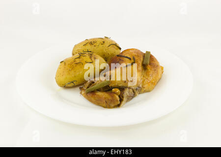 A delicious Rabbit stew and baked potatoes with rosemary Stock Photo