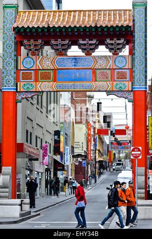 The gate to Chinatown and the restaurants, shops, and businesses beyond in Melbourne, Australia. Unidentified people. Public pla Stock Photo