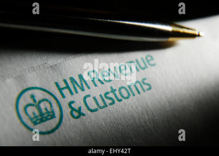 A pen is pictured on an HM Revenue and Customs logo on a self assesment tax statement Stock Photo