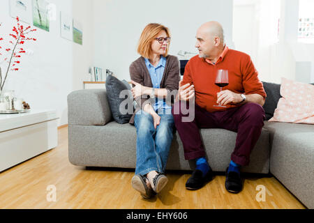 Senior couple drinking red wine at home Stock Photo