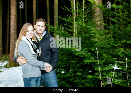 Young couple searching for the perfect Christmas tree Stock Photo