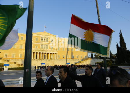 Athens, Greece. 18th Mar, 2015. Kurdish protester march past the Greek Parliament with various Kurdish flags. Kurdish people in Athens marched to the EU offices in Athens, protesting in support of the Kurdish people in Syria, and called for the Turkish president Erdo?an to support them against the Islamic State. © Michael Debets/Pacific Press/Alamy Live News Stock Photo