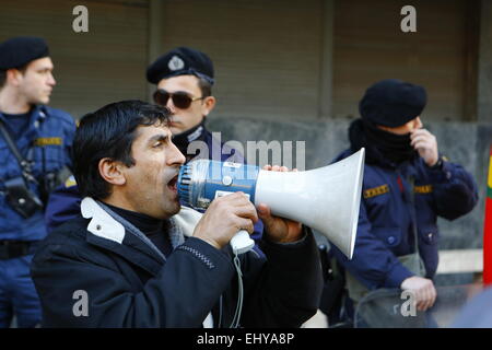 Athens, Greece. 18th Mar, 2015. A Kurdish protester shouts slogans towards the EU offices in Athens. Riot police can be seen in the background. Kurdish people in Athens marched to the EU offices in Athens, protesting in support of the Kurdish people in Syria, and called for the Turkish president Erdo?an to support them against the Islamic State. © Michael Debets/Pacific Press/Alamy Live News Stock Photo