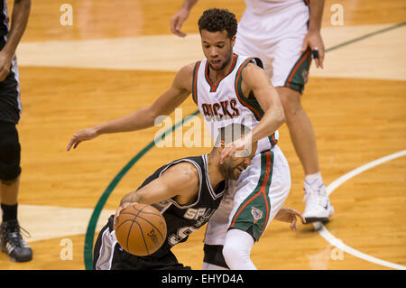 Milwaukee, Wisconsin, USA. 18th Mar, 2015. San Antonio Spurs guard Tony Parker #9 is fouled dribbling toward the basket during the NBA game between the San Antonio Spurs and the Milwaukee Bucks at the BMO Harris Bradley Center in Milwaukee, WI. Spurs defeated the Bucks 114-103. John Fisher/CSM/Alamy Live News Stock Photo