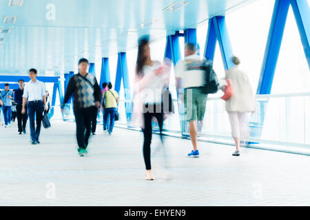 Motion blurred commuters in Hong Kong Stock Photo