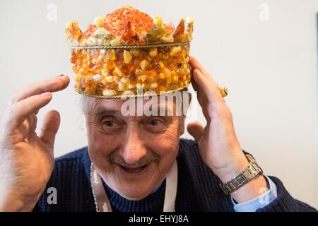 Vilnius, Lithuania. 18th Mar, 2015. An exhibitor shows his handmade crown at the 'Amber Trip' show in Vilnius, Lithuania, on March 18, 2015. Lithuania held the 'Amber Trip' show on March 18-21, gathering exhibitors and customers from countries and regions including Lithuania, Latvia, Poland, Russia, Ukraine and China. © Alfredas Pliadis/Xinhua/Alamy Live News Stock Photo