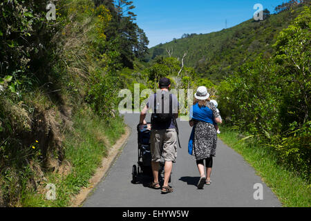 Family walking in Zealandia botanical gardens, Wellington, North Island, New Zealand Stock Photo