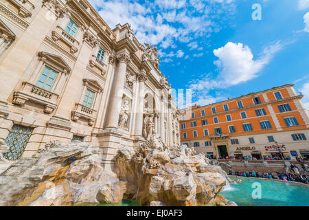 Trevi fountain with blue sky and clouds in a sunny day in Rome, Italy. Stock Photo