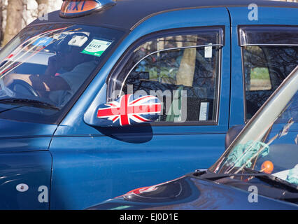 A London taxi displaying a patriotic taste in wing-mirror decoration Stock Photo