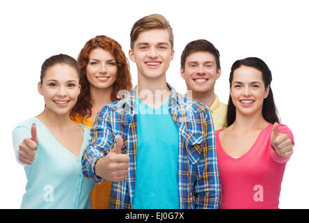 group of smiling teenagers showing thumbs up Stock Photo