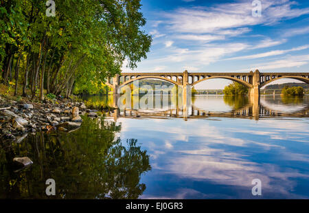 The Veterans Memorial Bridge reflecting in the Susquehanna River, in Wrightsville, Pennsylvania. Stock Photo