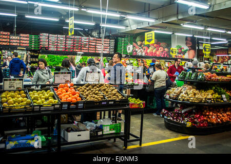 People shopping for produce at the South Melbourne Markets on a busy Saturday. Stock Photo