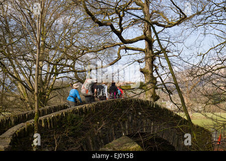 Ambleside Cumbria  19th March 2015 Spring day Tourists take advantage of the warm weather and Spring sunshine Clappersgate Bridge on the River Brathay Credit:  Gordon Shoosmith/Alamy Live News Stock Photo