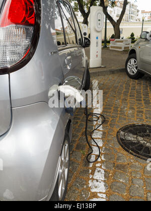 Peugeot Ion full electric car at a charging station in Portugal Stock Photo