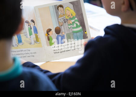 Two british primary schoolboys learning to read in a UK primary school Stock Photo