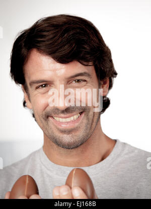 Man holding easter eggs Stock Photo