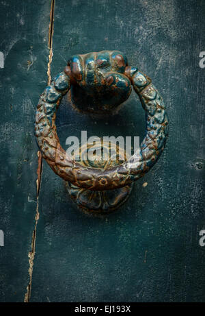 Vintage Ornate Grungy Door Knocker In Shape Of Hand Stock Photo
