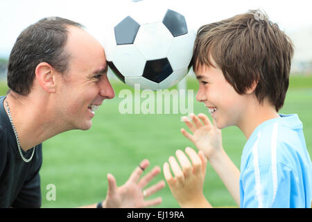 A young soccer player with father Stock Photo