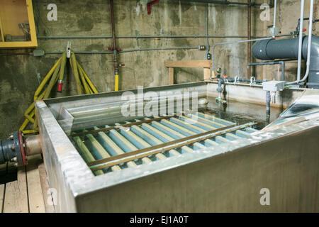 Wastewater aeration basin bubbling in a building Stock Photo