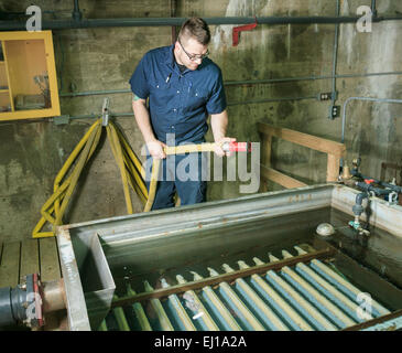 Wastewater aeration basin bubbling in a building Stock Photo