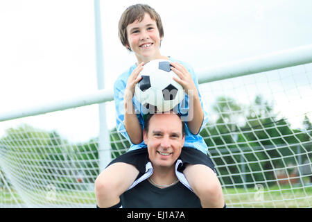 A young soccer player father Stock Photo