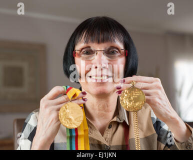 Breitenbrunn, Germany. 11th Mar, 2015. Former German athlete Baerbel Woeckel, photographed in her house in Breitenbrunn, Germany, 11 March 2015. Woeckel won four Olympic gold medals in 1976 and 1980 in the 200 meter and the 4x 100 meter relay. Today she works for the Deutscher Leichtathletik-Verband (German Athletics Association). Photo: Frank Rumpenhorst/lhe/dpa/Alamy Live News Stock Photo