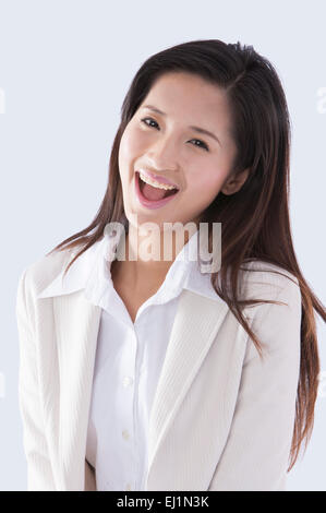 Young business woman laughing happily, Stock Photo