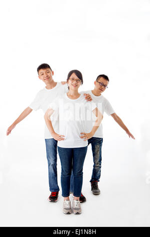 Teenager standing and smiling with thumbs up together Stock Photo