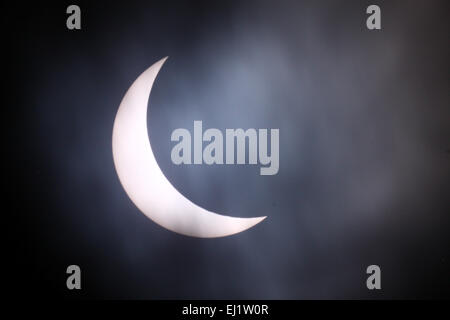 Leeds, UK, 20th Mar, 2015. Leeds, UK, 20th Mar, 2015. Despite the cloudy start in Leeds there was enough break in the clouds to capture the solar eclipse, in this image it looks like the moon is biting a large chunk out of the sun. Taken on the 20th March 2015. © Andrew Gardner/Ģ����ý Live News Credit:  Andrew Gardner/Ģ����ý Live News Stock Photo