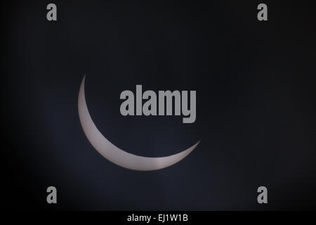 Leeds, UK, 20th Mar, 2015. Despite the cloudy start in Leeds there was enough break in the clouds to capture the solar eclipse, with the eclipse coming to totality it looks like the moon is biting a large chunk out of the sun. Taken on the 20th March 2015. Credit:  Andrew Gardner/Ģ����ý Live News Stock Photo