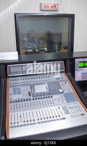 Unification Media Group, Mar 20, 2015 : Announcer Jang Seul-gi records broadcasting at a radio studio of the Unification Media Group (UMG) in Seoul, South Korea. The UMG is private shortwave radio station targeting North Korea, which is a consortium made by the Radio Free Chosun and the Open Radio for North Korea. In December 2014, North Korea's Rodong Sinmun criticized the broadcaster, UMG, calling it 'an anti-Republic clown show of provocation', according to local media. © Lee Jae-Won/AFLO/Alamy Live News