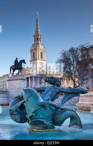 The Church of St Martin in the Fields, the statue of King George 1V, and the mermaid statue by Sir Charles Wheeler in the... Stock Photo