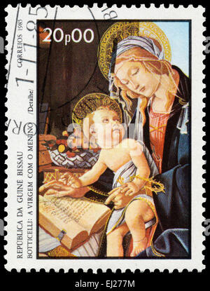 GUINEA BISSAU - CIRCA 1985: Stamp printed in Guinea-Bissau shows Virgin and Child by Botticelli, circa 1985 Stock Photo