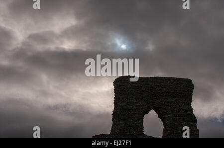 Dunnydeer Hill Fort, Inch, Scotland, UK. 20th Mar, 2015. The partial solar eclipse viewed through a gap in the clouds, over the 13th Century Castle ruins on top of Dunnydeer Hill Fort, Inch, Scotland, Friday 20th March 2015. Credit:  Malcolm Gallon/Ģ����ý Live News Stock Photo