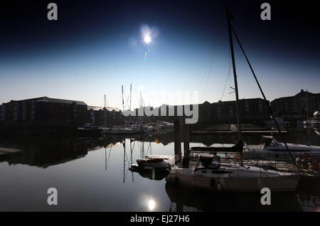 Swansea, UK. Friday 20 March 2015  Pictured: The solar eclipse as seen from Swansea Marina, south Wales.  Re: People across most of the UK have enjoyed a good view of the solar eclipse on Friday morning.  The eclipse was viewable from approximately 08:22am.  The next visible partial eclipse for people in the UK will not happen until August 2026.  The phenomenon happens when the moon passes between the Sun and the Earth. Credit:  D Legakis/Ģ����ý Live News Stock Photo